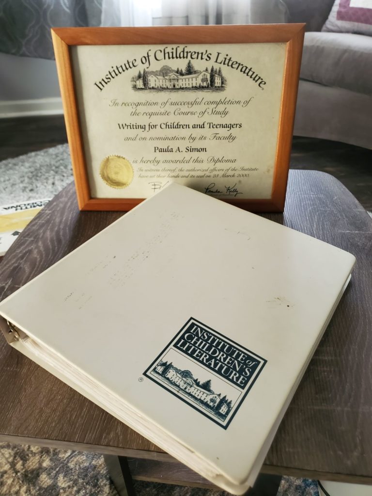 Copy of a Diploma and Binder with school materials